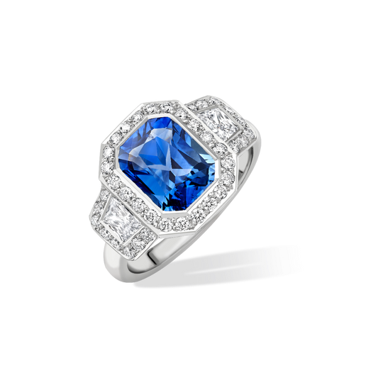 Radiant cut sapphire and trapeze diamond cluster ring