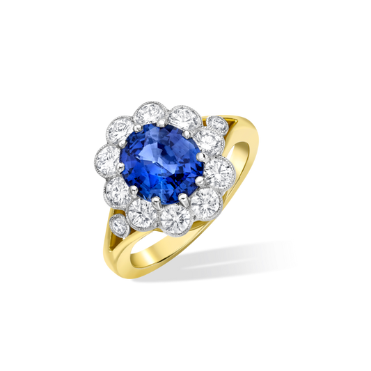 Oval sapphire and diamond cluster ring