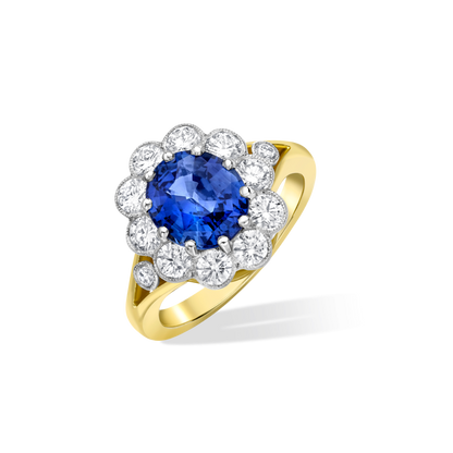 Oval sapphire and diamond cluster ring